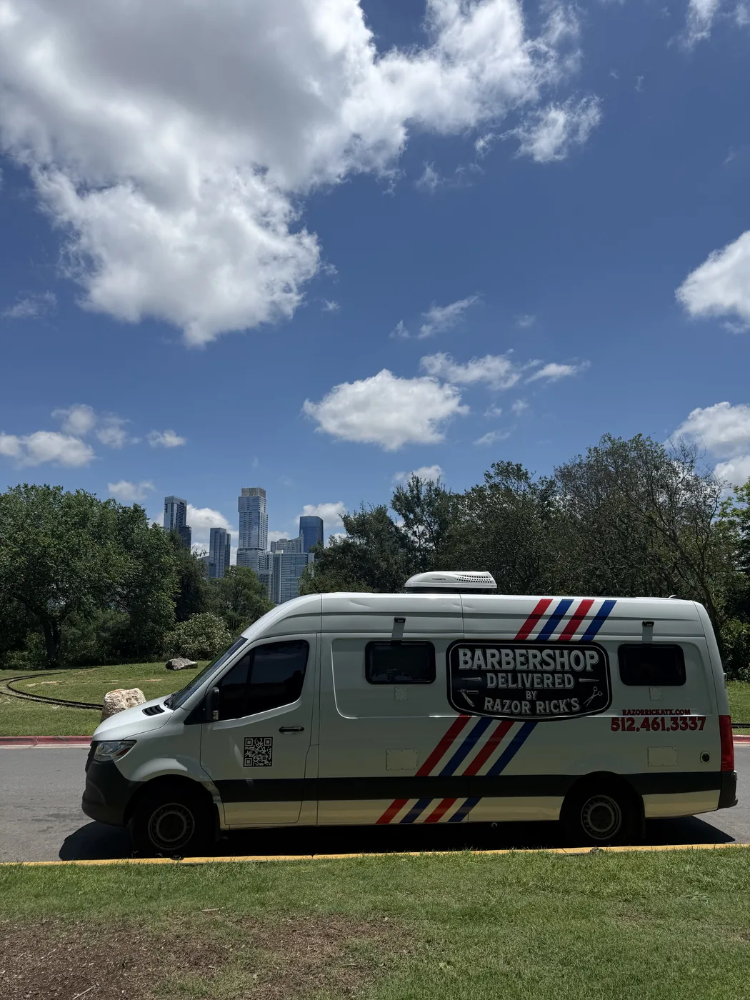 Razor Rick's mobile barbershop Mercedes Sprinter van with Austin Texas skyline